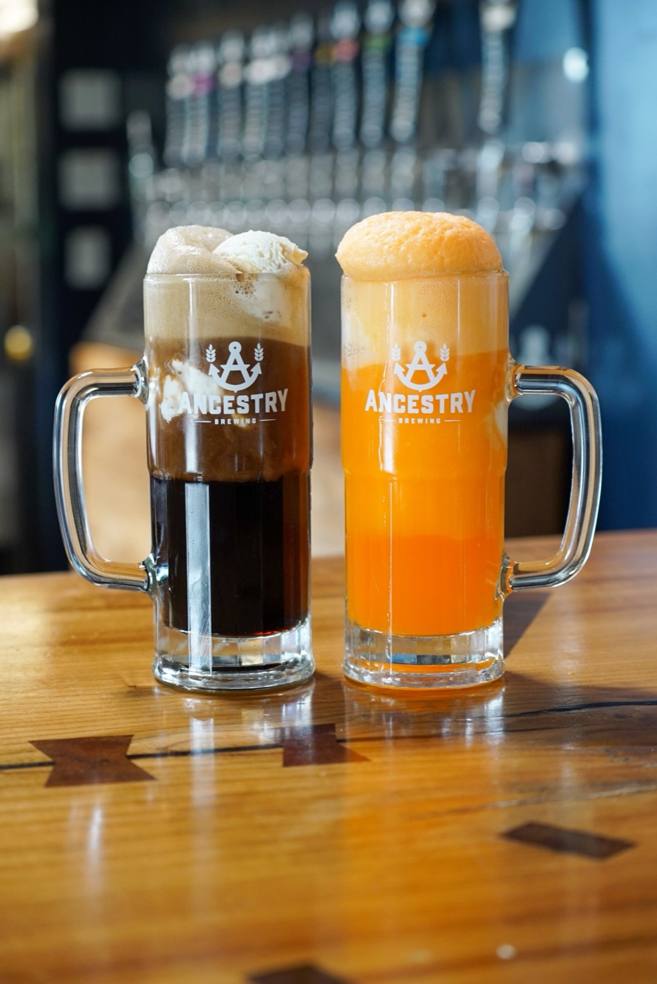 A root beer float and an orange cream float in Ancestry mugs